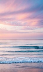 Obraz premium Pastel Sunset over a Serene Beach and Ocean
