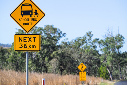 Rural school bus route road sign, back to school in outback Queensland Australia, remote distance to education, country family life