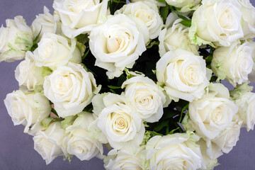 top down view of bouquet of white roses is displayed in a vase
