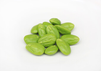 Stink beans (Parkia speciosa) on white background.
