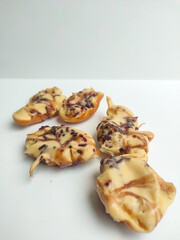 half-cooked indonesian mini pancake (pinch cake or kue cubit) with chocolate sprinkled