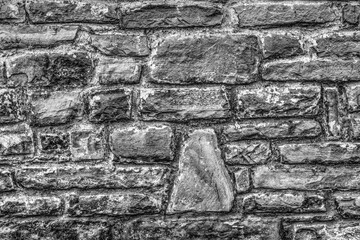 Stone wall background in black and white close up view
