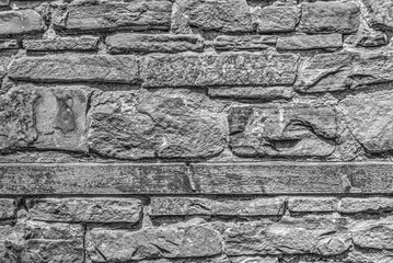 Stone wall background in black and white close up view