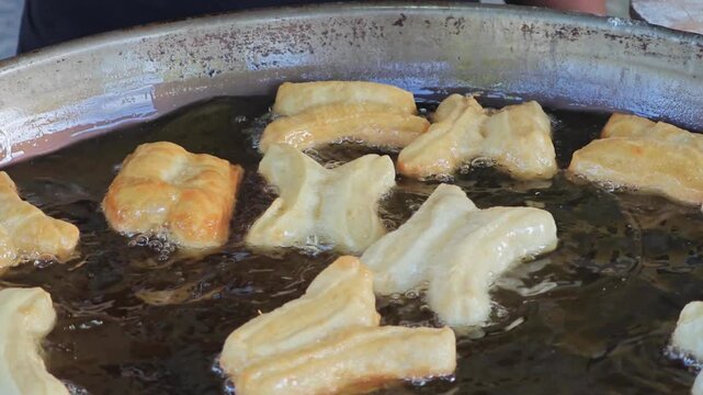 Fried dough sticks on the background