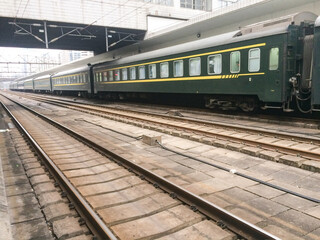 Naklejka premium Train station, green-skinned train