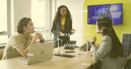 Presenter initiating green energy discussion in office using turbine models with animated data
