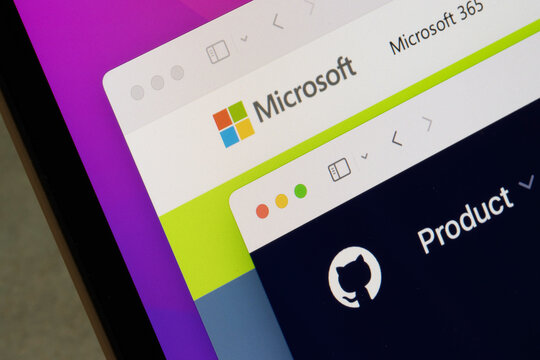 Portland, OR, USA - Aug 25, 2025: Homepages of Microsoft and GitHub are seen on the screen of a computer. GitHub, a software development platform, was acquired by Microsoft Corporation in 2018.