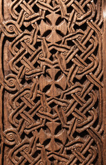 Close-up photo of a traditional Armenian wooden carving featuring Cross elements