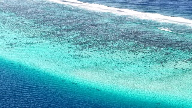 French Polynesia. Aerial View of Coral Reefs Barrier Between Lagoon and South Pacific Ocean