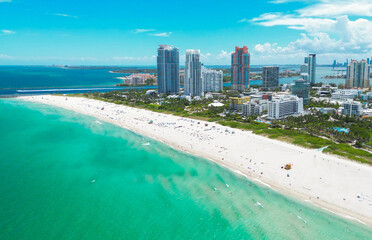 Fototapeta na wymiar Top view of South Miami Beach. Scenic drone view of Miamis famous coastline. Miami Beach skyline with skyscrapers. Aerial view of Miami Beach in summer. Miami Beach shore with skyscrapers.