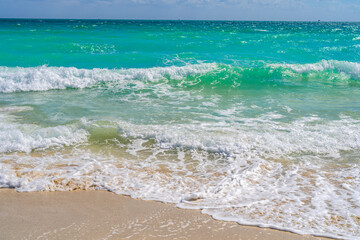 Ocean wave motion on sea shore. Summer sea breeze. Sea nature backdrop. Peaceful ocean. Dreamy ocean horizon. Coastal ocean paradise wallpaper. Seafoam waves. Azure water surface. Golden hour beach.