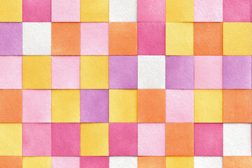 Checkerboard background. Geometric pastel square texture in vintage y2k style. Hippie 70s pattern. Plaid pattern background. Pink, yellow, and orange colors.
