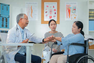 Asian daughter accompanies senior mother for medical consultation with doctor using digital health technology. Family centered care demonstrates intergenerational support and patient advocacy through