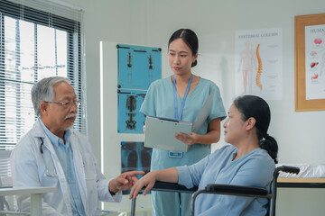 Asian healthcare providers deliver patient-centered consultation to senior woman, explaining...