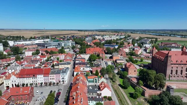 Aerial Gniew Poland historic village and castle slide 2. Northern Poland. Castle construction 13th century by Teutonic Knights. Vistula River. Agriculture land, river, forest and farm rural area.