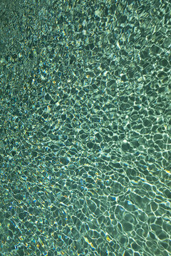 play of sun rays on water surface, texture, background