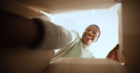 Black woman, open box and happy with POV in home, low angle or ecommerce for product, order or delivery. Person, excited and smile with cardboard package, parcel and online shopping at apartment
