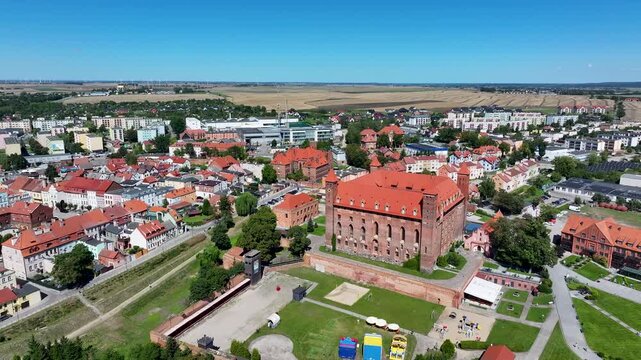 Aerial Gniew Poland historic village castle pull. Northern Poland. Castle construction 13th century by Teutonic Knights. Vistula River. Agriculture land, river, forest and farm rural area.