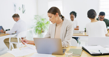 Obraz premium Paperwork, office or businesswoman with laptop for copywriting, news or research project. Document, coworking or copywriter in creative startup for article post, email marketing and networking online