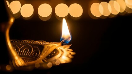 Diya lamp flame burning, Diwali celebration, spiritual rituals, Hindu festival of lights. Traditional oil lamp lighting, promoting inner peace, spirituality, focus.