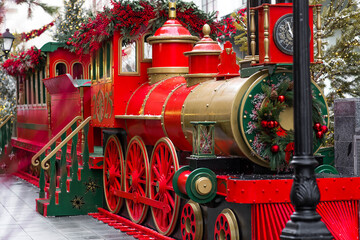 New Year's card 2026. Beautiful Christmas background. Christmas train on the street in Moscow. Concept of preparation and decoration for the New Year.