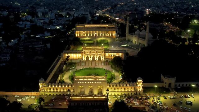 Aerial drone shot of lucknow building bada imambada  mosque with night lights  road at night with cars
