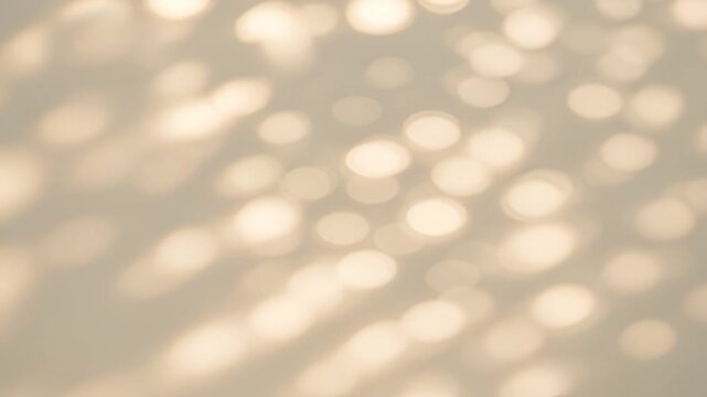 Soft sunlight bokeh on wall, dreamy natural abstract background video
