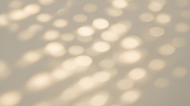 Soft sunlight bokeh on wall, dreamy natural abstract background video