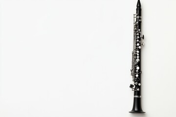 An elegant black clarinet positioned against a plain white backdrop, showcasing its intricate keys and sleek design. Perfect for music enthusiasts and instrument lovers.