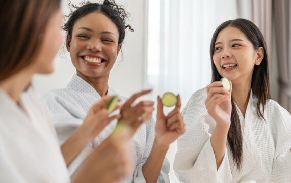 Diverse group of beauty women enjoy skincare routine, applying cucumber eye masks for hydration and wrinkle free skin, beauty self care spa, cosmetic, glowing and refreshing facial treatment at home