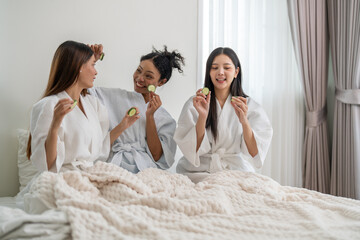 Diverse group of beauty women enjoy skincare routine, applying cucumber eye masks for hydration and wrinkle free skin, beauty self care spa, cosmetic, glowing and refreshing facial treatment at home