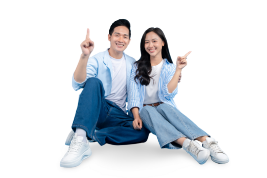 A happy couple pointing upwards on PNG background
