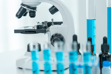 Scientist analyze biochemical samples in advanced scientific laboratory. Medical professional use microscope look microbiological developmental of viral. Biotechnology research in science lab.