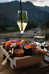 Japanese gourmet assortment with champagne outdoors