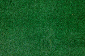 surface texture of green synthetic carpet