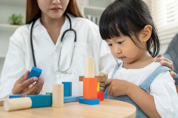 Pediatricians are checking the children development according to the appropriate age, doctors encourage the child to do activities, IQ, EQ, age appropriate learning activities and promotion, expect