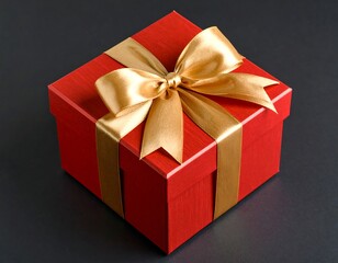 Obraz premium Red gift box with gold ribbon, dark background