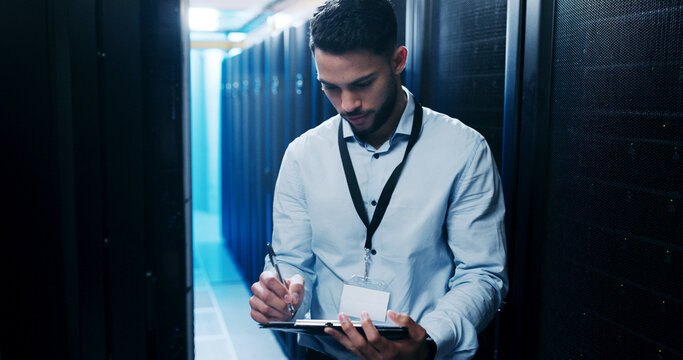 Man, writing notes and information technology in server room, solution and feedback at company. Person, programmer and clipboard with checklist, review and inspection for cybersecurity at agency