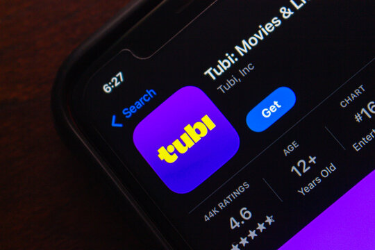 Mexico City, MEXICO - Aug 14 2025 : Detailed view of the Tubi streaming app on the App Store, showing ratings, age requirement, and install button in dark mode.