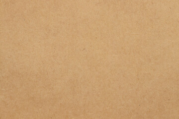 Brown cardboard sheet abstract background, texture of sepia color kraft paper with vintage pattern for design art work.