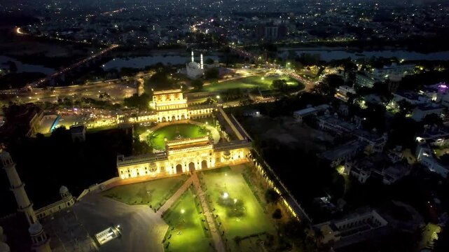 Aerial drone shot of lucknow building bada imambada  mosque with night lights  road at night with cars