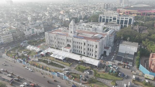Aerial side view of Ripon Building in Chennai city showcasing historic colonial architecture with surrounding roads and urban skyline.