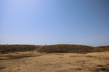 March 25 2025 Expansive Arid Landscape with Distant Hills under a Clear Blue Sky, Japan