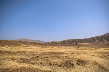 March 25 2025 Expansive Arid Landscape with Distant Hills under a Clear Blue Sky, Japan
