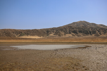 March 25 2025 Dry Plains with Small Water Puddle and Distant Mountain, Japan