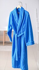 Blue Bathrobe Hanging in Bathroom