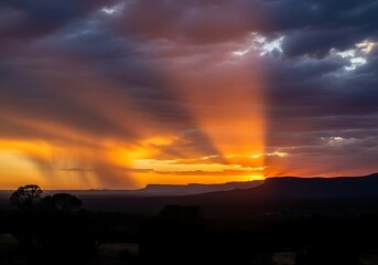 Fototapeta premium Dramatic sunset through stormy clouds