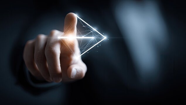 A hand in a dark suit points to a glowing, triangular arrow