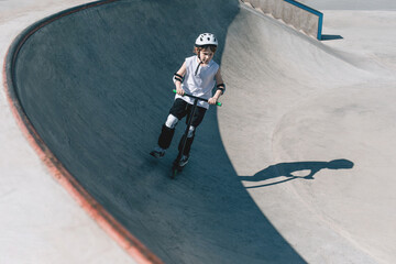 Young BMX Rider is Showcasing Stunt Tricks in Skatepark Environment