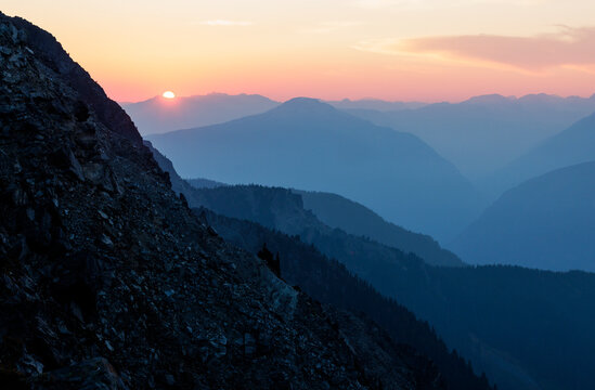 Alpenglow on far off mountain range